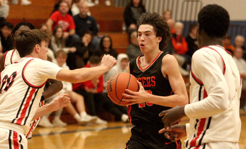 Crystal Lake Central’s Jackson Hopkins takes the ball to the hoop against Huntley during tournament basketball action at Johnsburg High School Monday evening.