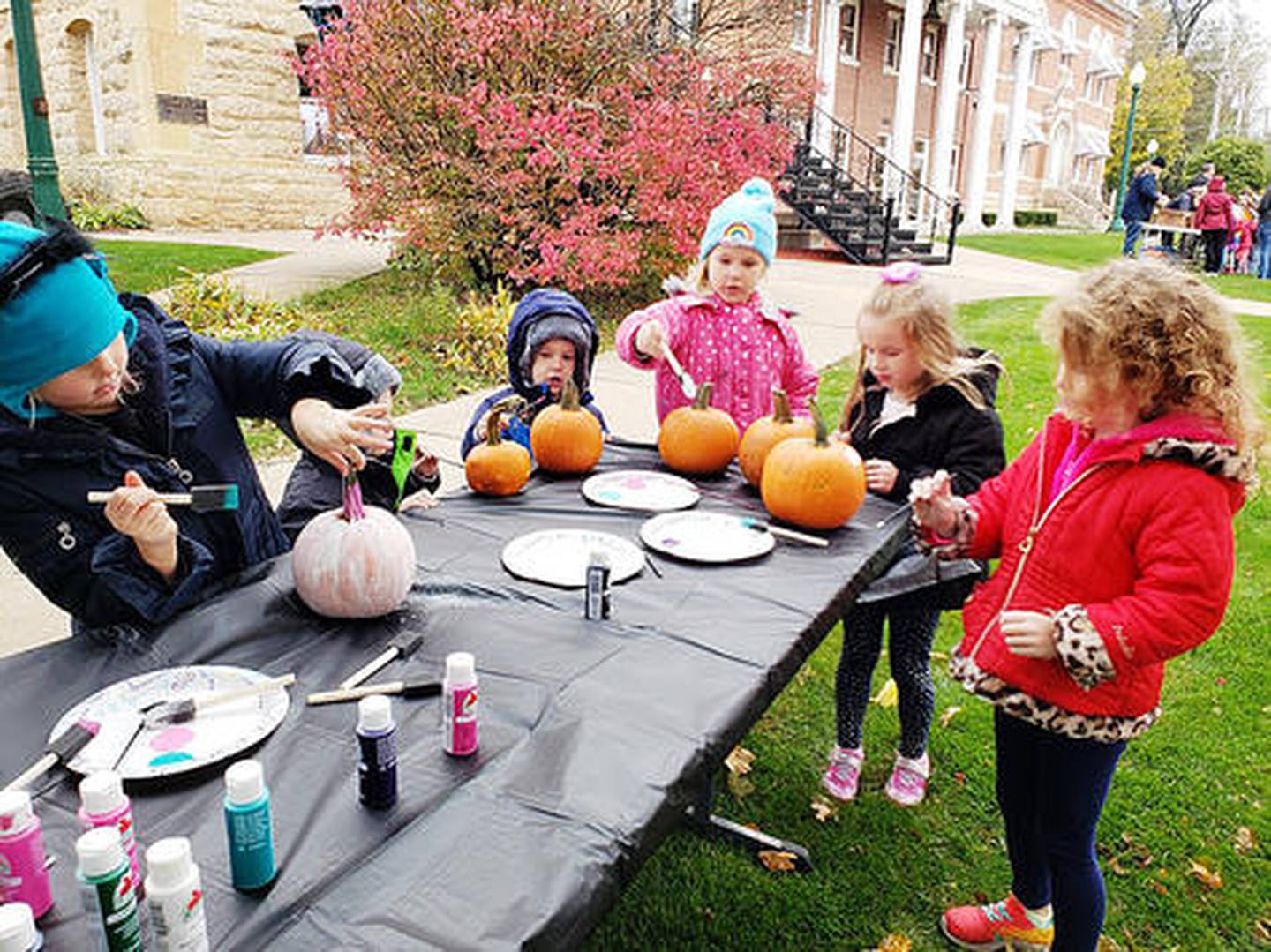 Pumpkin Painting is part of the fun at the Mt. Carroll Pumpkin Fest on Saturday, Oct. 26, 2024.