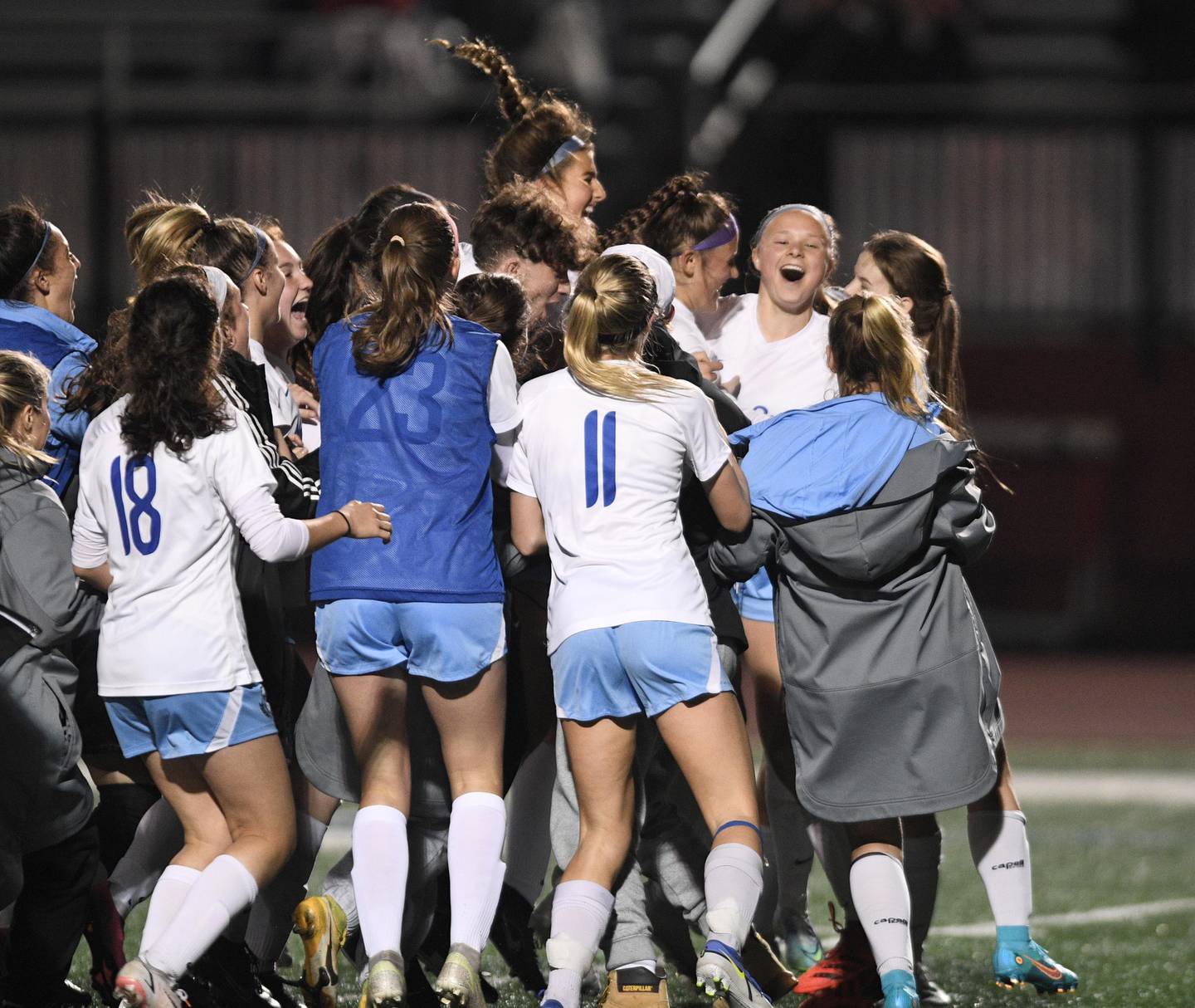 John Starks/jstarks@dailyherald.com
St. Charles North;s Lauren Balster, facing camera, celebrates her game-winning shootout goal against Benet Academy in the Naperville Invitational girls soccer tournament on Friday, April 22, 2022.