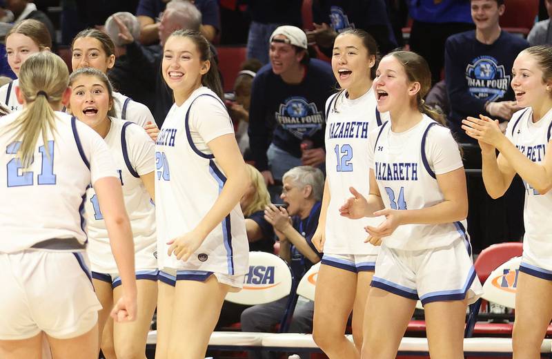 Members of the Nazareth girls basketball team react during a timeout in the Class 4A State girls basketball championship game on Saturday, March 7, 2026 at CEFCU Arena in Normal.