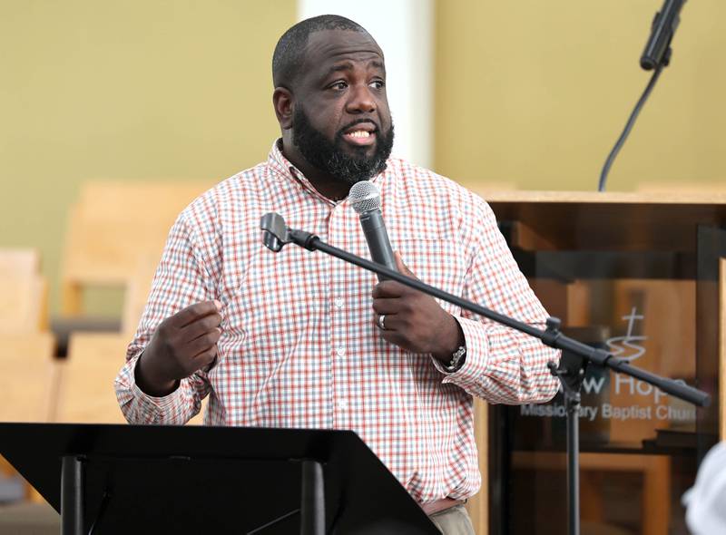 New Hope Missionary Baptist Church Pastor Joe Mitchell opens the informational meeting Thursday, May 18, 2023, at his church in DeKalb, regarding the the proposed plans for the vacant lot on the corner of Blackhawk Road and Hillcrest Drive.