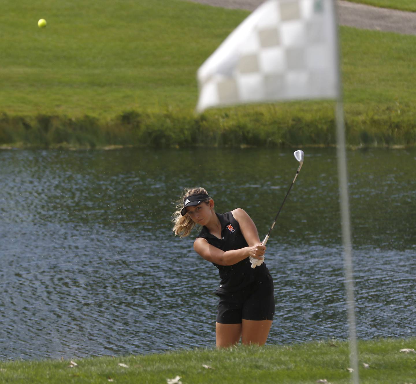 McHenry’s Madison Donovan chips onto the 12th green during the Fox Valley Conference Girls Golf Tournament Wednesday, Sept. 21, 2022, at Crystal Woods Golf Club in Woodstock.