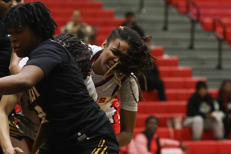 Bolingbrook’s Sydney Dodd grimaces in pain going for a rebound before leaving the game against Joliet West on Thursday, Jan 23, 2025 in Bolingbrook.