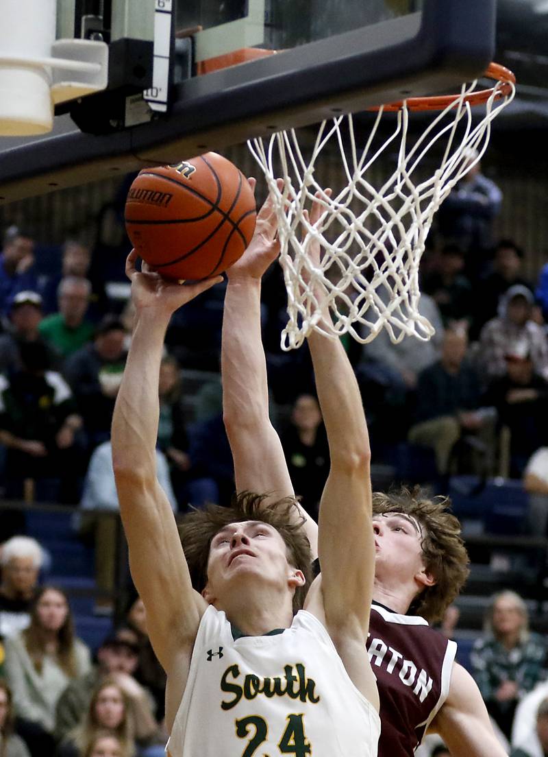 Crystal Lake South's James Carlson shoots the ball in front of Wheaton Academy's Ben Dehaan during the IHSA Class 3A Cary-Grove Boys Basketball Regional Championship game on Friday, Feb. 23, 2024 at Cary-Grove High School.