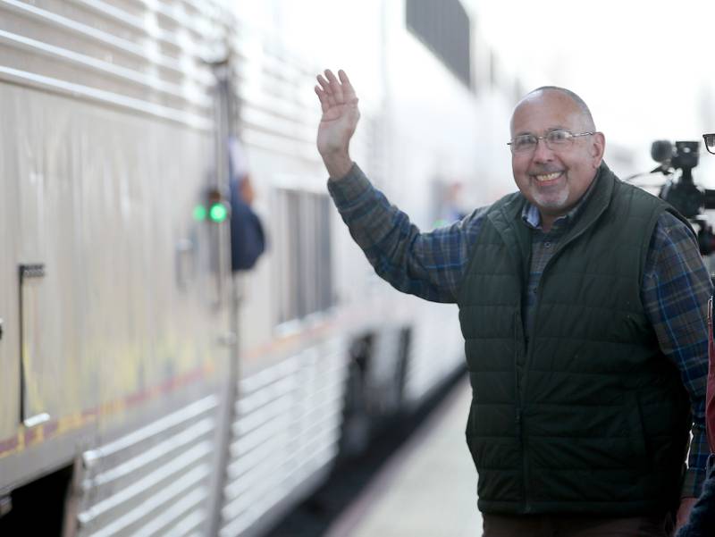 Princeton mayor Ray Mabry waves to passengers on the Amtrak Illinois Zephyr during the 75th anniversary of the trains visit on Tuesday, March 19, 2024 in Princeton. On March 20, 1949 the debut of the original California Zephyr, a joint offering of the Chicago, Burlington & Quincy; Denver & Rio Grande Western; and Western Pacific.