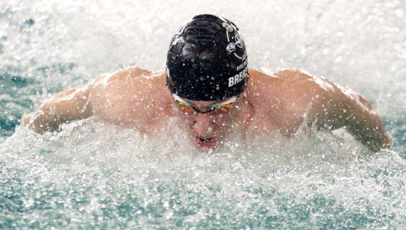 Noah Brereton of Cary-Grove co-op swims the butterfly leg of the 200-Yard Medley Relay during the Fox Valley Conference Swimming Championships at Woodstock North High School Saturday.