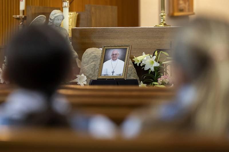 A picture of Pope Francis sits on the altar Wednesday, April 23, 2025, at St. Anne’s Church in Dixon. Students from the school were invited in to pray the rosary for the recently deceased pontiff.