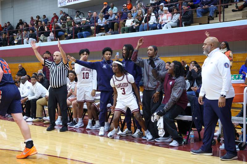 Kankakee players celebrate a 3-pointer by Cedric Terrell III (3) during the Kays' 74-60 victory over Mahomet-Seymour on Tuesday, Dec. 2, 2025.