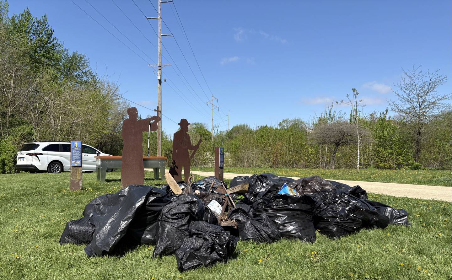 A pile of collected trash sits along the I&M Canal during the 10th annual Perfectly Flawed Earth Day cleanup at Lock 14 on Saturday, April 18, in La Salle.