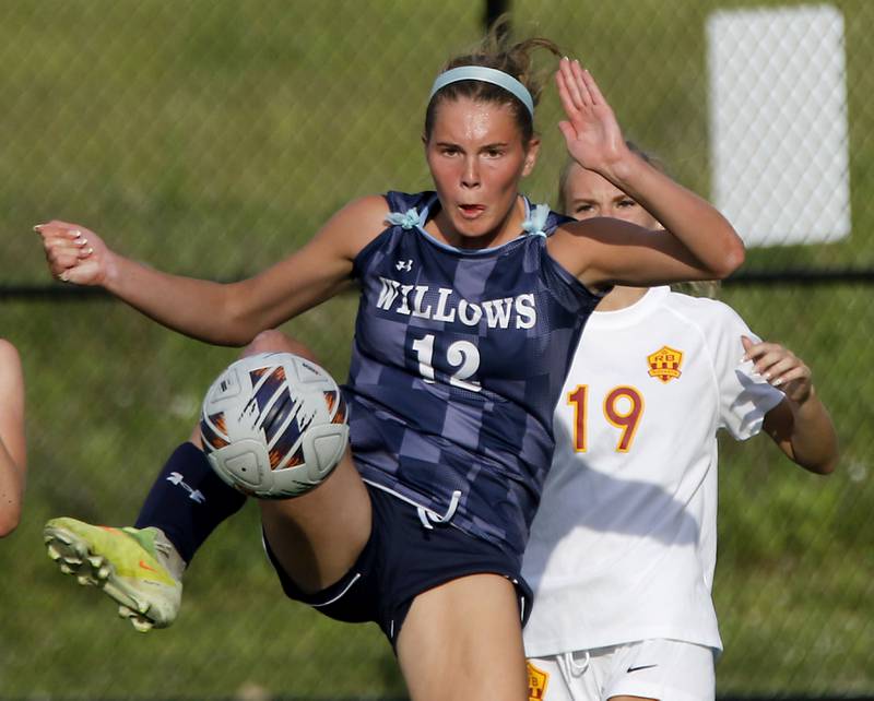 Willows Academy's Mary Seuffert takes a shot at goal in front of Richmond-Burton's Sydney Frericks during an IHSA Class 1A Cristo Rey St. Martin Sectional semifinal girls soccer match on Tuesday, May 26, 2026 at Cristo Rey St. Martin College Prep, in Waukegan.