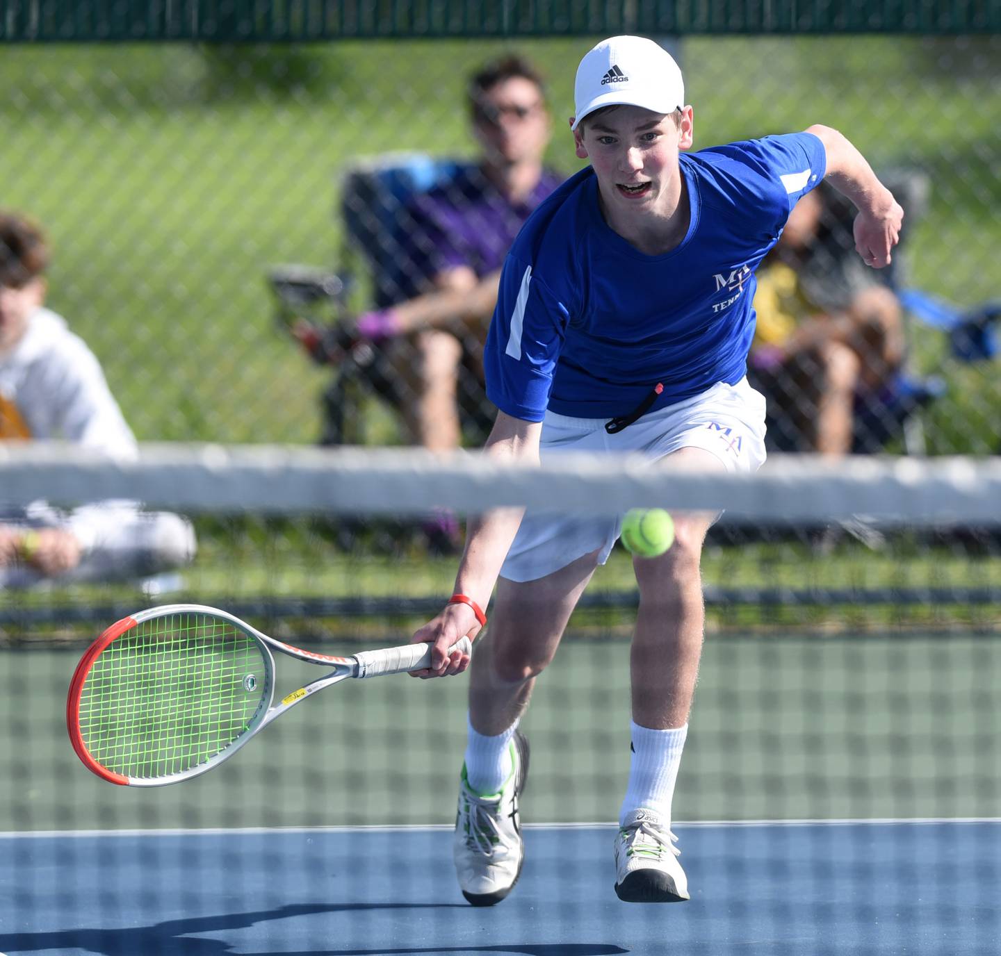 Joe Lewnard/jlewnard@dailyherald.com
Marmion singles player Benedict Graft hurries to play the ball at the net during the boys Class 1A state tennis semifinals at Hersey High School in Arlington Heights Saturday.