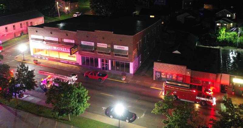 Firetrucks pack along 5th Street across from the Westclox building to respond to  fire on Friday, July 14, 2023 in Peru. The fire began at 8:19p.m. A MABAS box alarm was issued to the fourth level and then brought back down after the fire was contained.