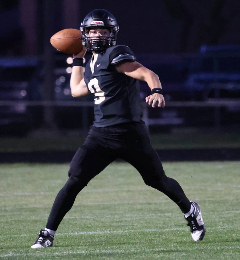 Sycamore's Griffin Larsen makes an off-balance throw during their game against Mahomet-Seymour Friday, Sept. 12, 2025, at Sycamore High School.