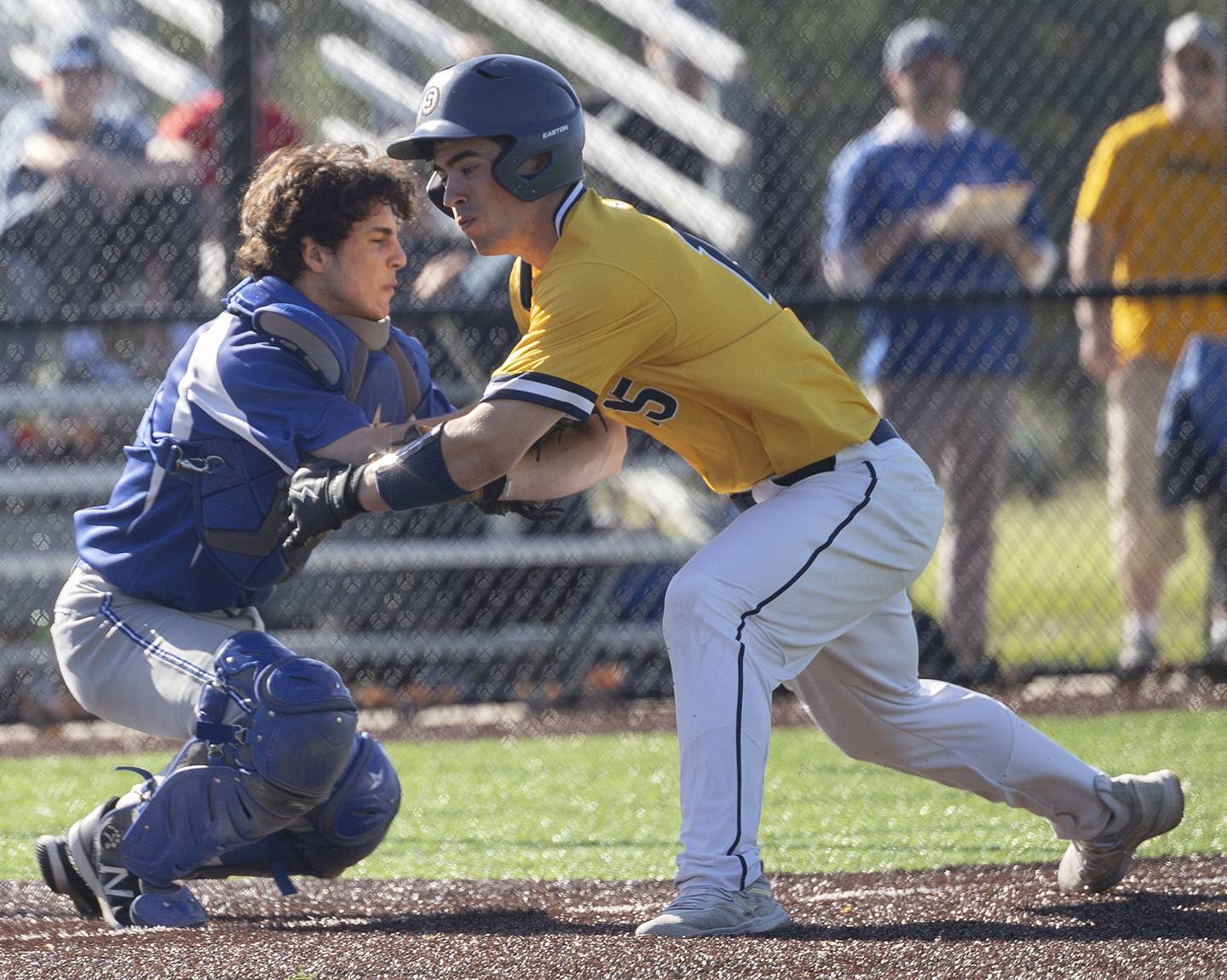 Sterling’s Mason Smithee is tagged out by Princeton’s Ace Christiansen trying to score on a sacrifice Tuesday, May 7, 2024 at Sterling’s Gartner Park.