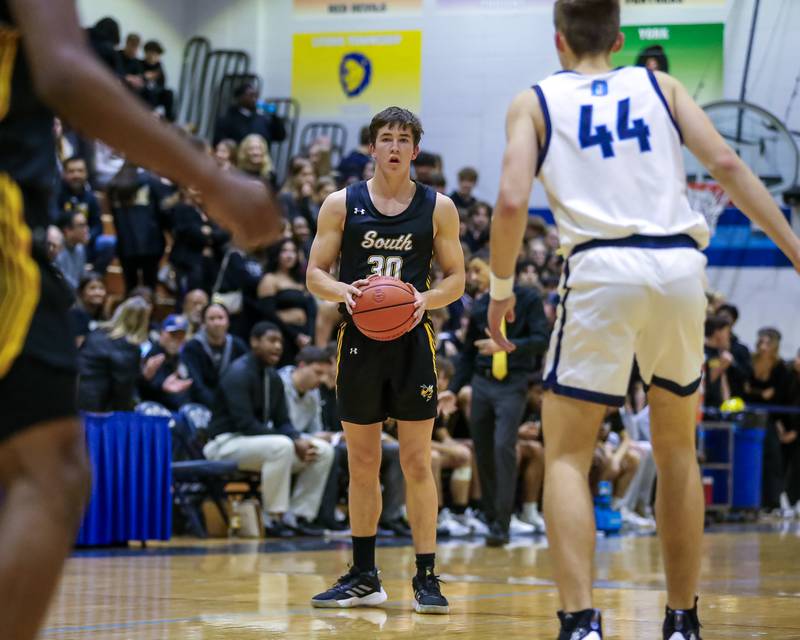 Hinsdale South's Brendan Savage (30) looks to pass during basketball game between Hinsdale South at Downers Grove South. Dec 1, 2023.