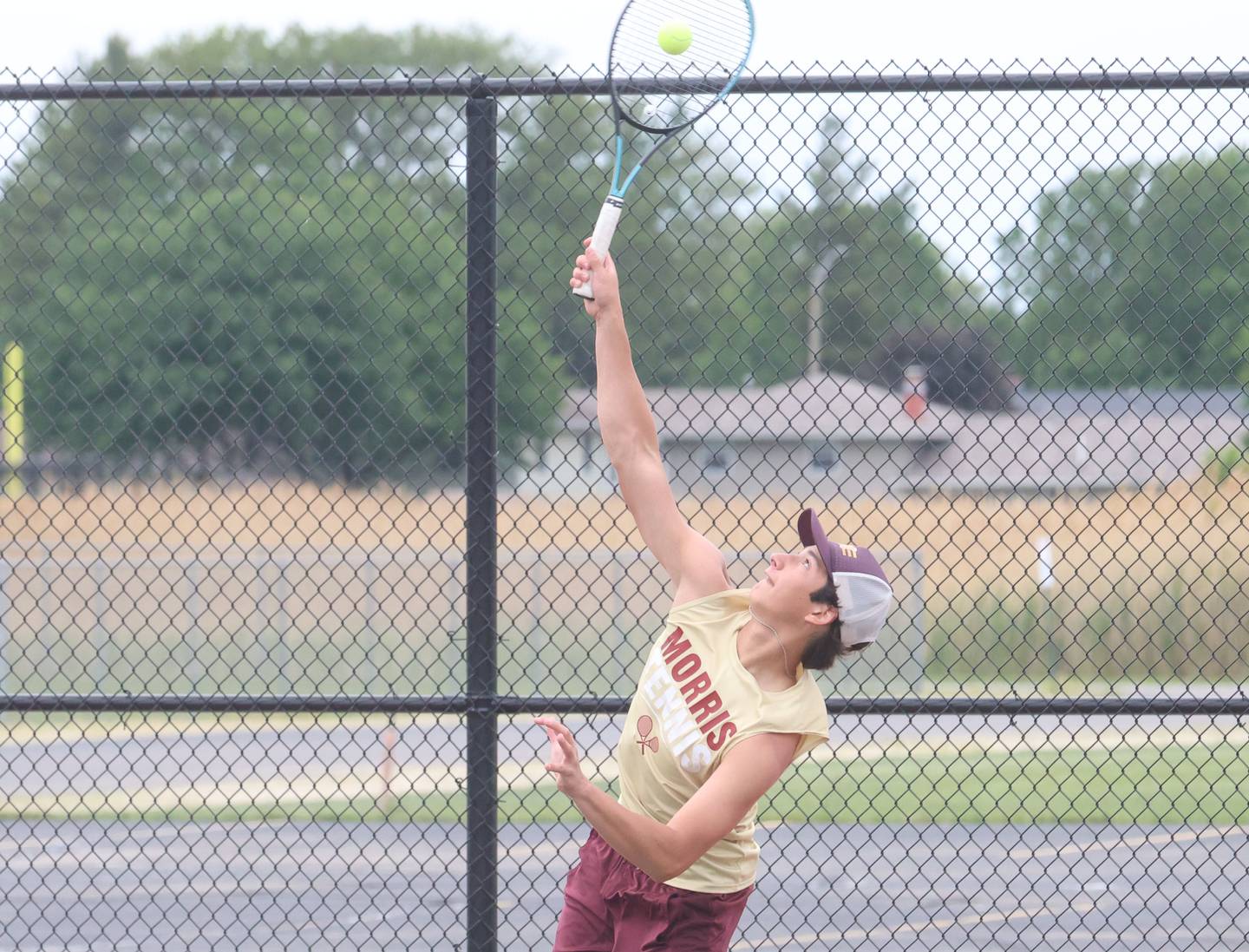 Morris's Andrew Ochoa serves the ball during the Class 1A Sectional tennis meet on Friday, May 22, 2026 at the La Salle-Peru Township High School Athletic Complex in La Salle.