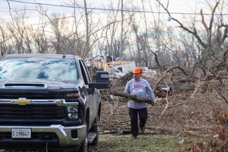 Team Rubicon member Doc Kirk, a veteran of Mt. Pulaski, assists with debris removal in the Oakwoods subdivision in Aroma Township on March 19, 2026 following the March 10 tornado.