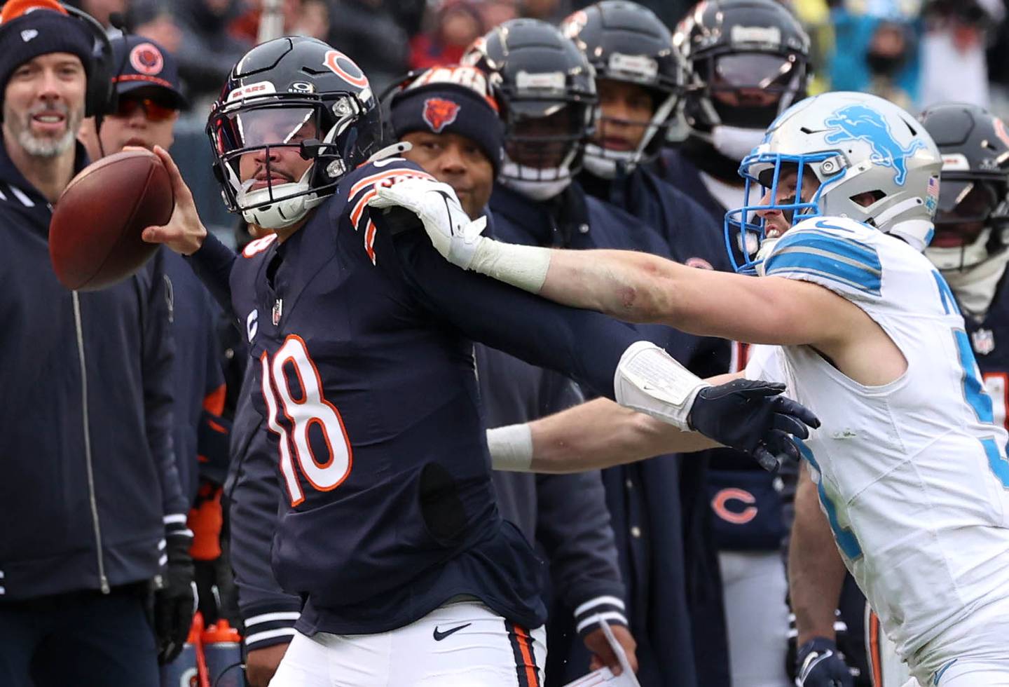 Chicago Bears quarterback Caleb Williams is pushed out of bounds by Detroit Lions linebacker Ben Niemann during their game Sunday, Dec. 22, 2024, at Soldier Field in Chicago.
