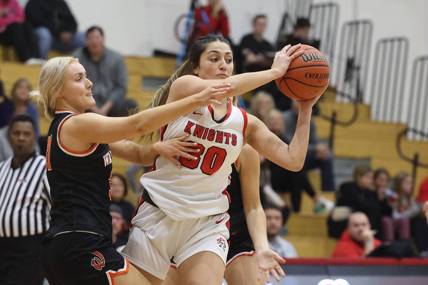 Lincoln-Way Central’s Lina Panos passes off the ball against Lincoln-Way West on Tuesday, Dec. 5, 2023 in New Lenox.