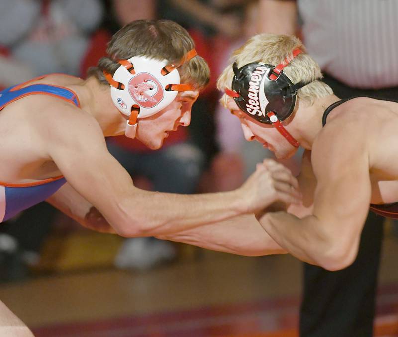 Oregon's Seth Stevens and Fulton's Ben Fosdick lock arms in a Dec. 2 bout at the Blackhawk Center.