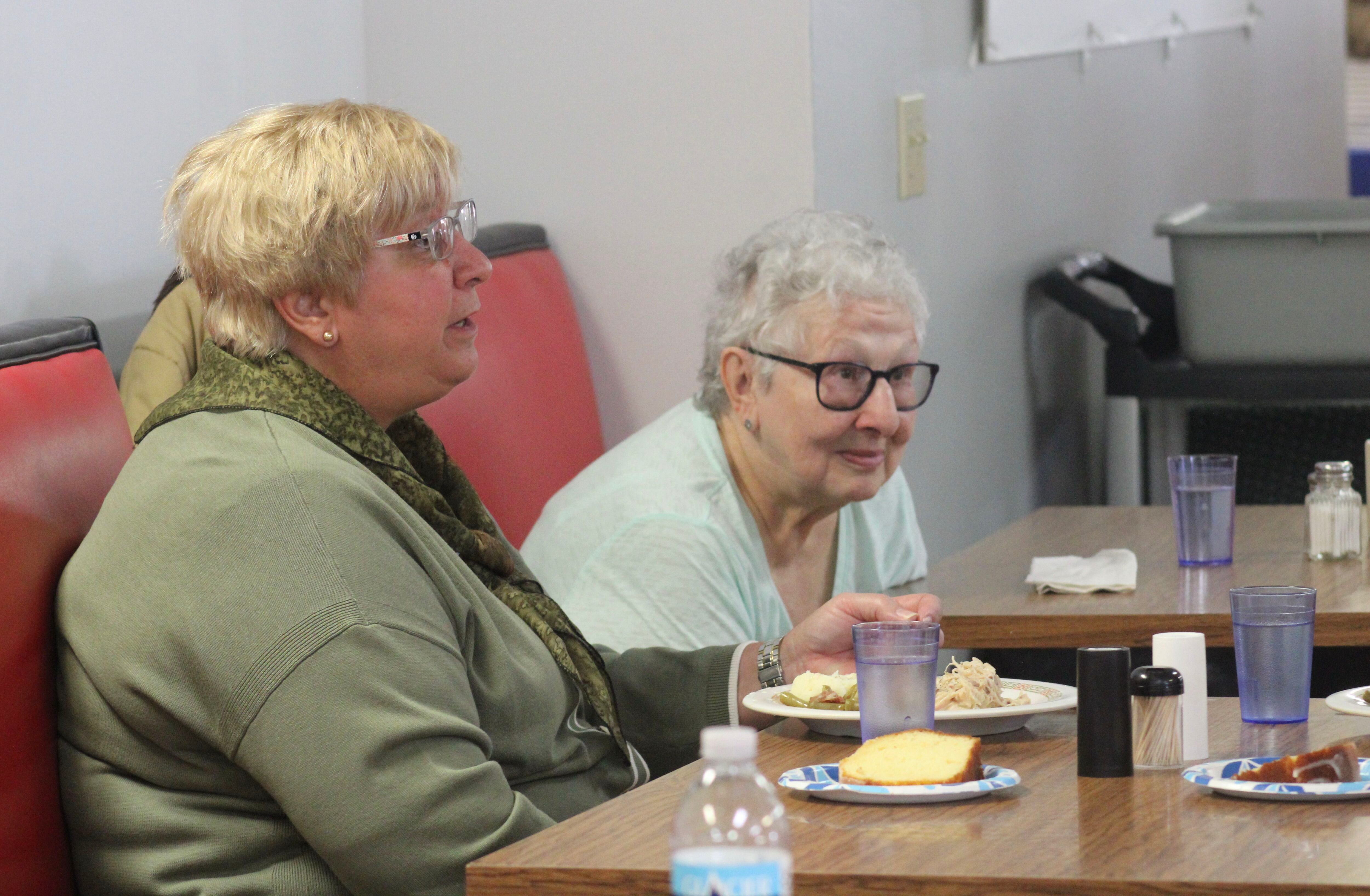 Paula Basta, left, director for the state Department on Aging, dines on Friday, March 10, 2023, at the Whiteside County Senior Center.