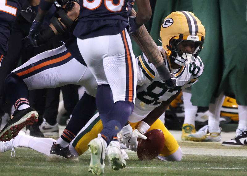 Green Bay Packers wide receiver Romeo Doubs can’t corral the on-side-kick and it is recovered by the Chicago Bears Saturday, December 20, 2025, during their game at Soldier Field in Chicago.