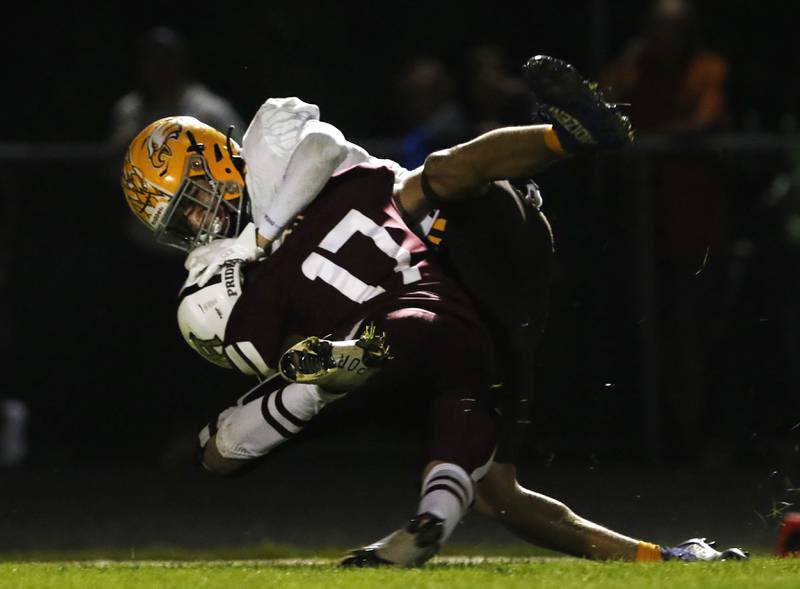 Prairie Ridge's Logan Harlow tackles Jacobs' Nick True during a Fox Valley Conference football game between Jacobs and Prairie Ridge Friday, Sept. 16, 2022, at Jacobs High School in Algonquin.