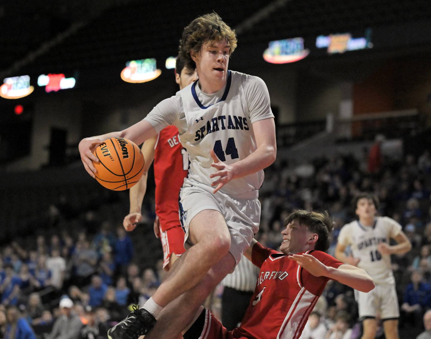 St. Francis’ Benjamin Whorlow fouls Deerfield’s Charlie Yellen in the IHSA Class 3A supersectional championship game at the Now Arena in Hoffman Estates on Monday, Mar. 9 2026.