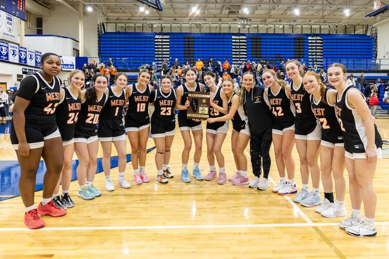 Lincoln-Way West celebrates after winning the 4A L-W East Regional Championship game against Lincoln-Way East on Feb. 20, 2025.