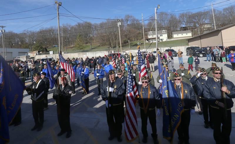 Veterans stand for the National Anthem during the annual Pearl Harbor parade and memorial service on Saturday in Peru. This year marks the 83rd anniversary of the Dec. 7, 1941, attack on Pearl Harbor.