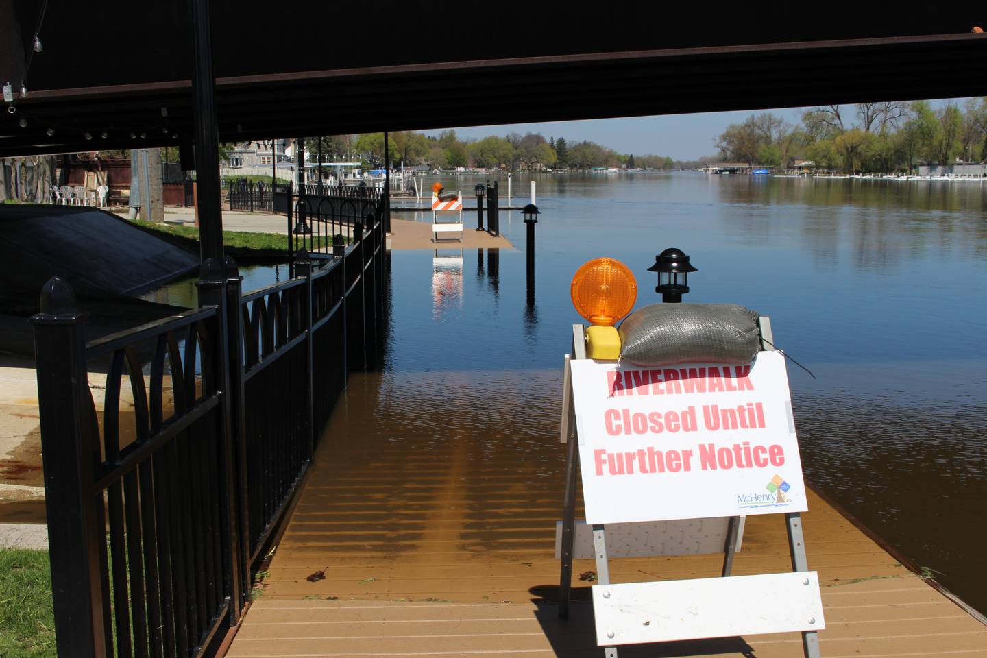 The McHenry Riverwalk under the Pearl Street bridge is pictured on April 22, 2026, after it was shut down because of Fox River flooding.