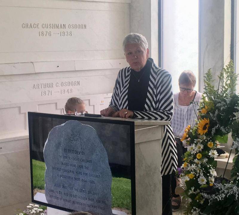 Woodstock resident Gail Sorensen talks during a ceremony Sunday to recognize 48 children who died in the orphanage system.
