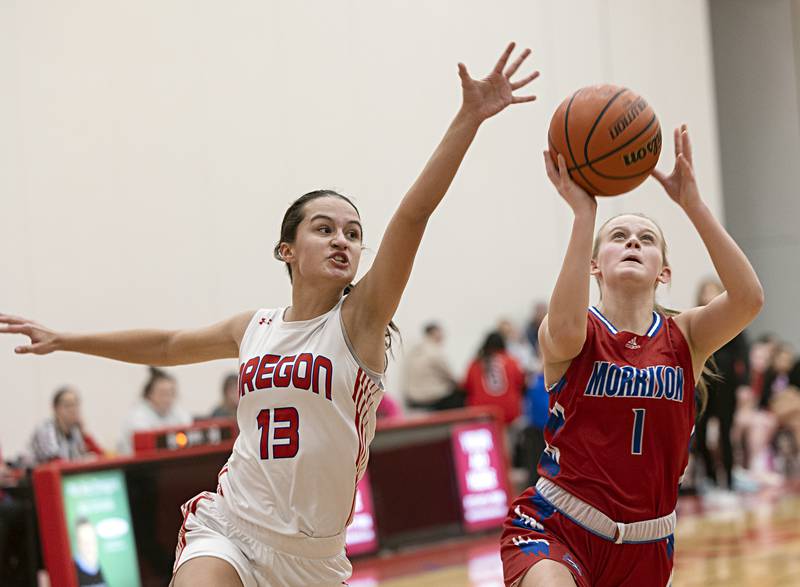 Morrison’s Emery Brewer puts up a shot while Oregon’s Sarah Eckhardt defends Wednesday, Jan. 17, 2024 at Oregon High School.