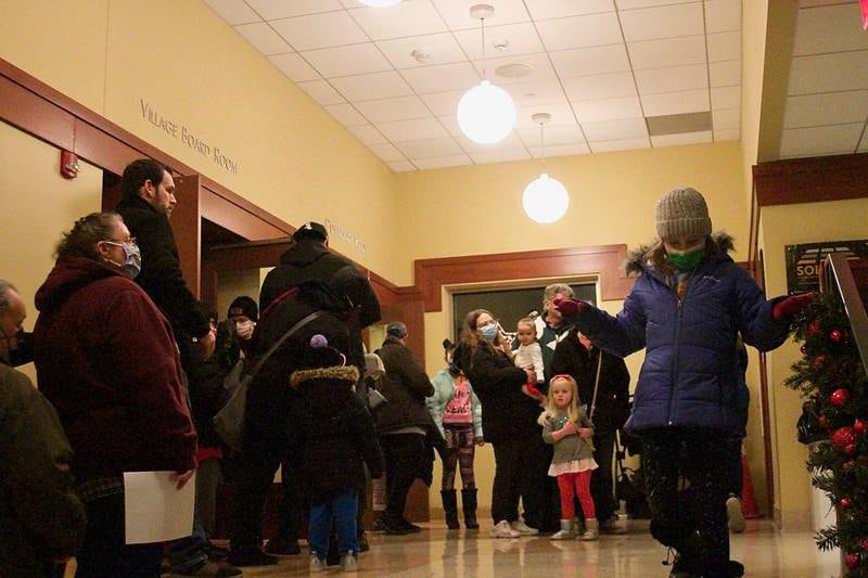 Families lined up in Montgomery's Village Hall Dec. 5, waiting for their opportunity to meet Santa and Mrs. Claus.