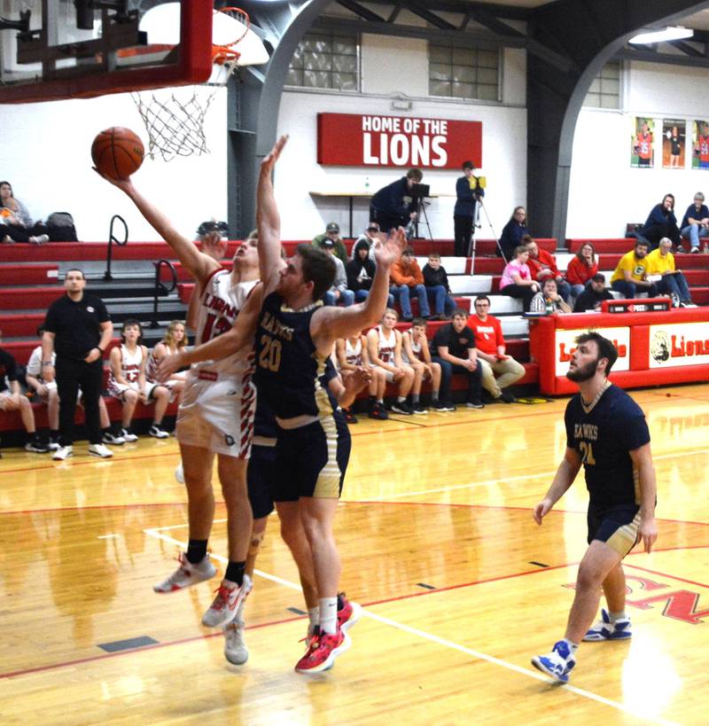 LaMoille's Josh Martin takes in a second-half layup against Hiawatha Wednesday night at Dean Madsen Gymnasium. He scored 21 points to lead the Lions to a 62-54 victory
