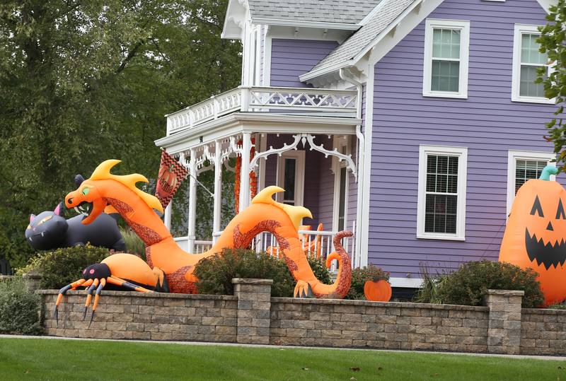 This home located in the 500 block of East Peru Street has giant cat, dragon and pumpkin inflatables on Wednesday, Oct. 11, 2023 in Princeton.