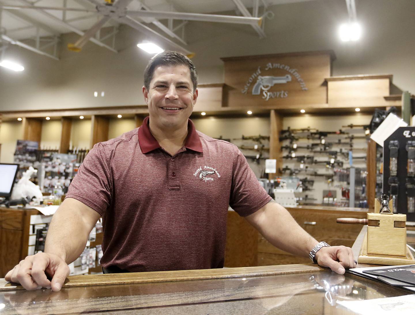 Bert Irslinger, the general manager of Second Amendment Sports, inside the gun shop in McHenry, on Thursday, Dec. 1, 2022. Democrats  in the state Legislature unveiled a plan that would immediately outlaw the sale of assault weapons and prevent most residents under 21 from legally buying a gun.