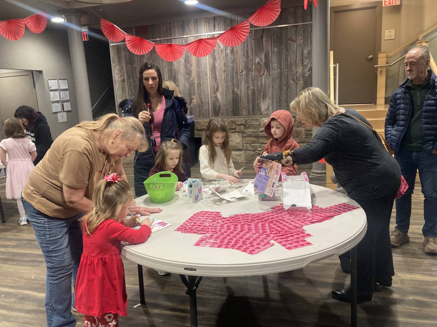Kids work at the Valentine table making cards for loved ones at the Joliet Area Historical Museum's Valentine's Day Party on Feb. 8, 2025.