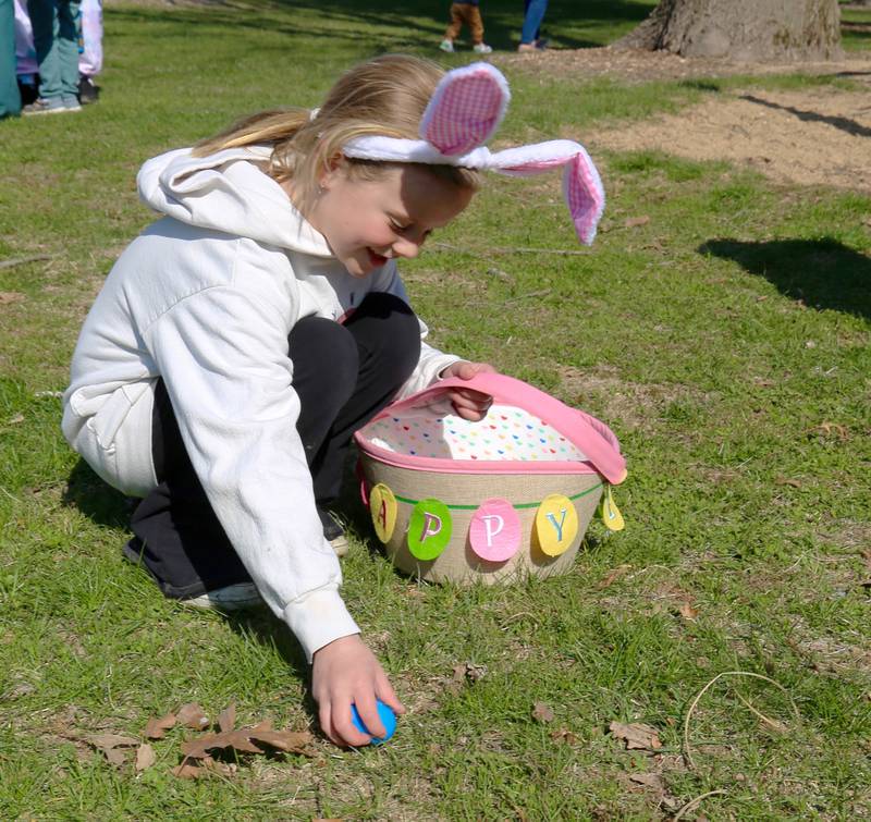 Seven year old Peyton Hall finds an egg at the Elburn Lions Easter Egg Hunt on Saturday, April 12, 2025 in Elburn.