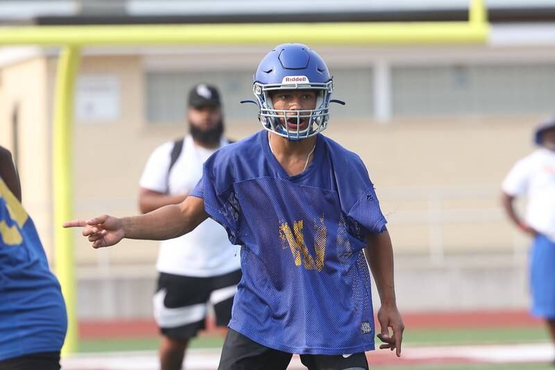 Joliet Central linebacker Christian Smith directs the play before the snap at Morris’ 7 on 7 scrimmage on Tuesday, July 23, 2024.