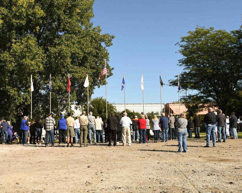 Community members gather during a dedication ceremony marking the completion of phase one of the DeKalb Elks Veteran’s Memorial Plaza in DeKalb Saturday, Oct. 1, 2022.
