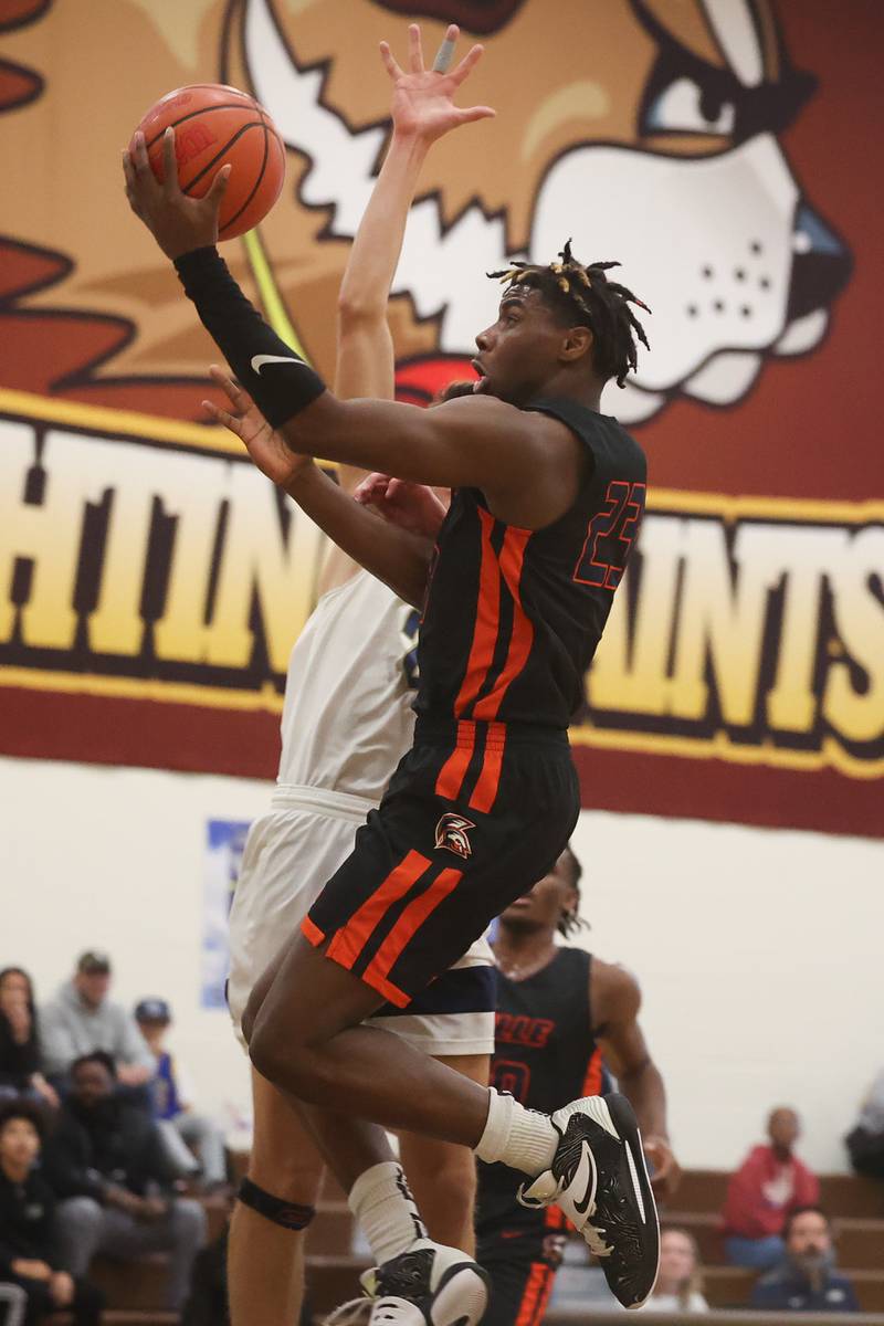 Romeoville’s Denonte Cunningham lays in a shot against Lemont in the WJOL Thanksgiving Classic Championship in Joliet on Saturday.
