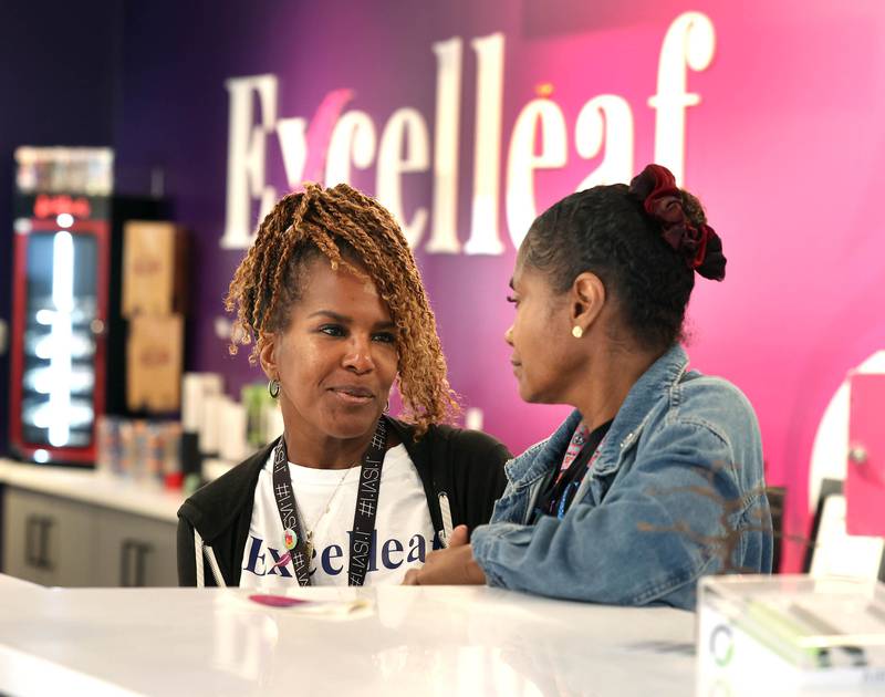 Two of Excelleaf’s owners Maria Davis, (left) and Crystal Anderson talk Friday, June 20, 2025, at the marijuana dispensary in DeKalb.