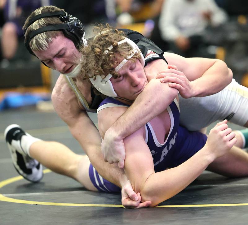 Sycamore’s Zack Crawford works to turn Plano’s Gio Diaz during their 160 pound championship match Saturday Jan. 21, 2023, during the Interstate 8 Conference wrestling tournament at Sycamore High School.