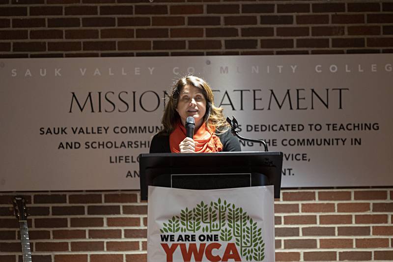 Karla Belzer, YWCA board president, opens the remarks Friday, Jan. 19, 2024 as the organization celebrates 100 years serving in the Sauk Valley.
