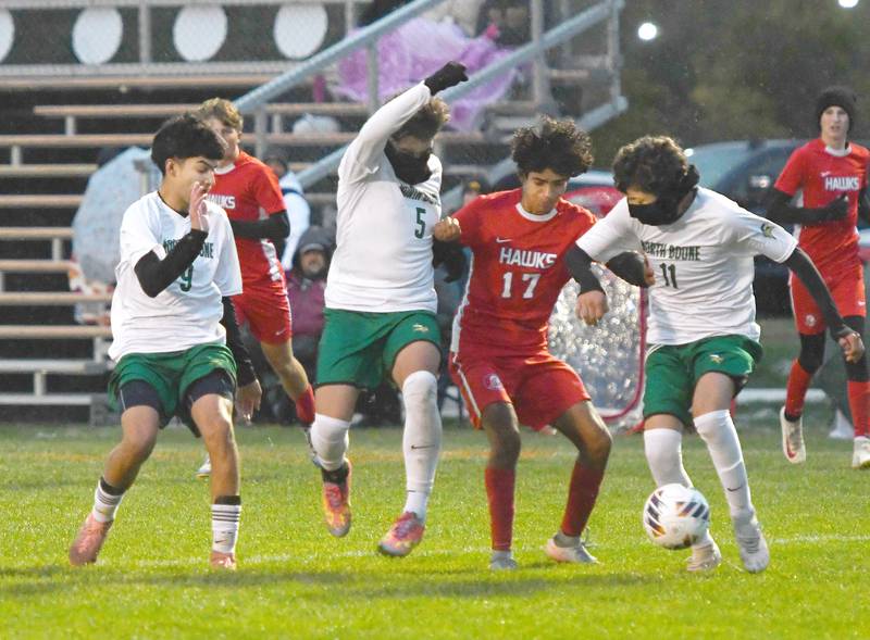 Oregon's Irvin Acosta (17) battles three North Boone defenders at the 1A Byron Regional on Tuesday, Oct. 21, 2025.