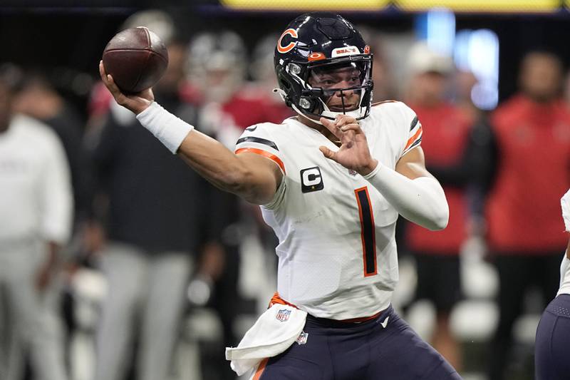 Chicago Bears quarterback Justin Fields works in the pocket against the Atlanta Falcons during the first half, Sunday, Nov. 20, 2022, in Atlanta.