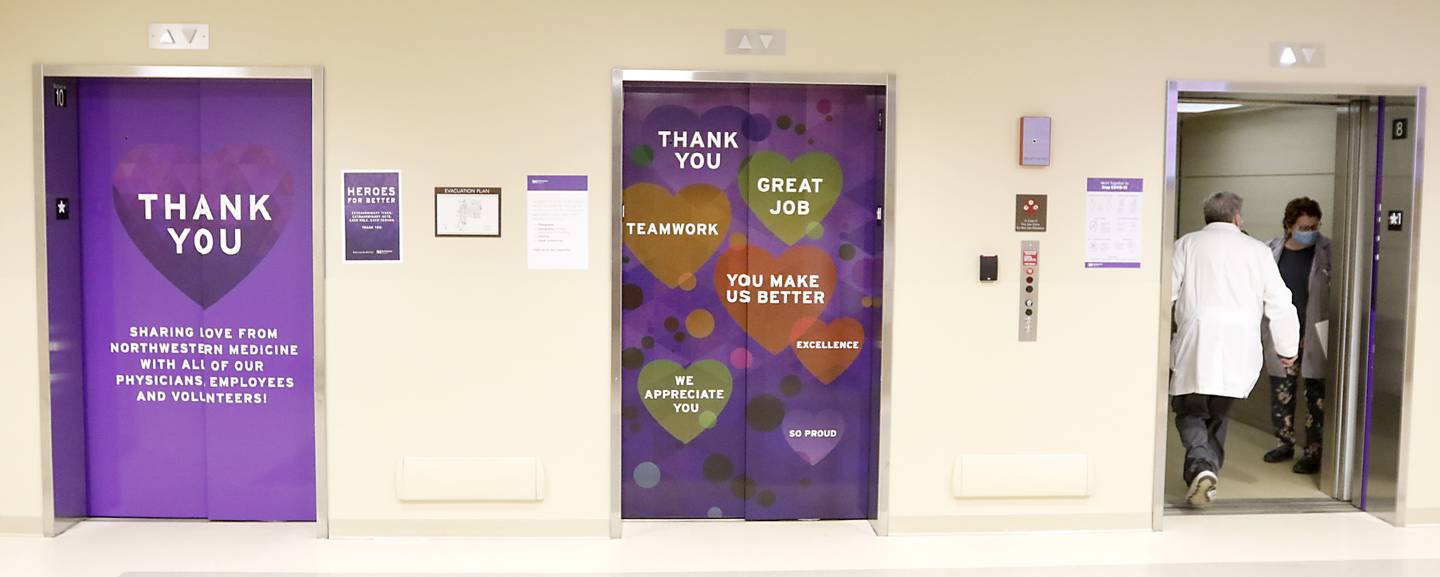 Hospital staff enters one of three elevators at Northwest Medicine Huntley Hospital that thanks embers of the hospital staff Wednesday, Feb. 16, 2022, at the hospital.