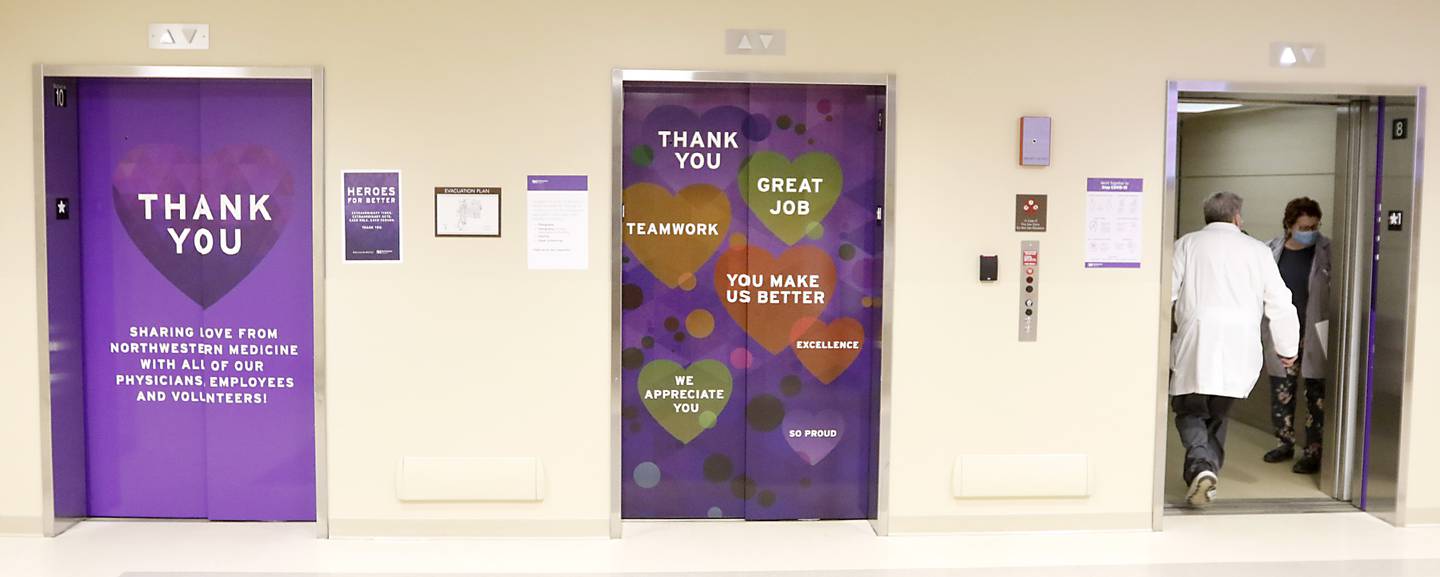 Hospital staff enters one of three elevators at Northwest Medicine Huntley Hospital that thanks embers of the hospital staff Wednesday, Feb. 16, 2022, at the hospital.