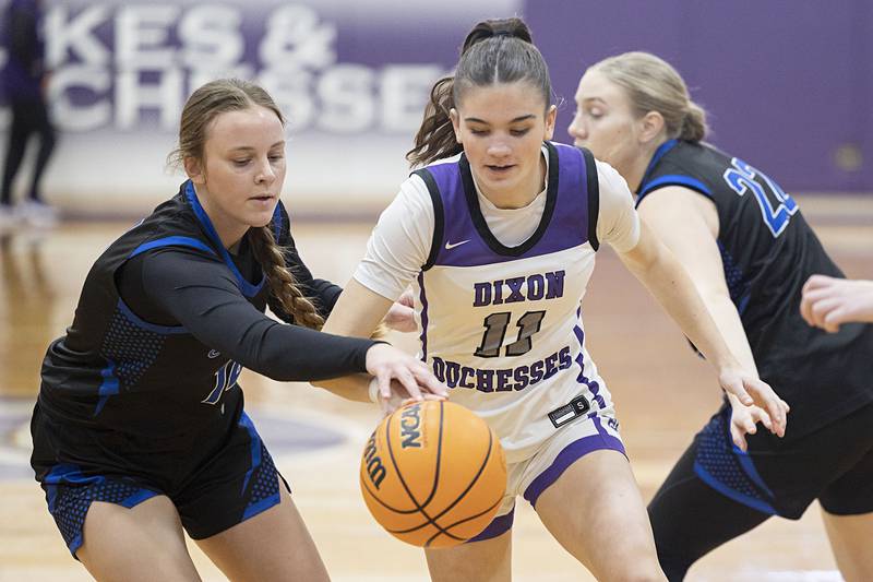 Dixon’s Kiley Gaithe works against St. Francis’ Talia Engesser Saturday, Jan. 10, 2026.